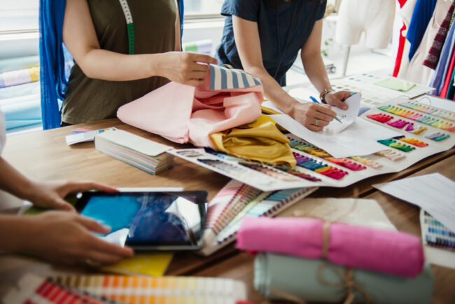 Fashion designers working in studio